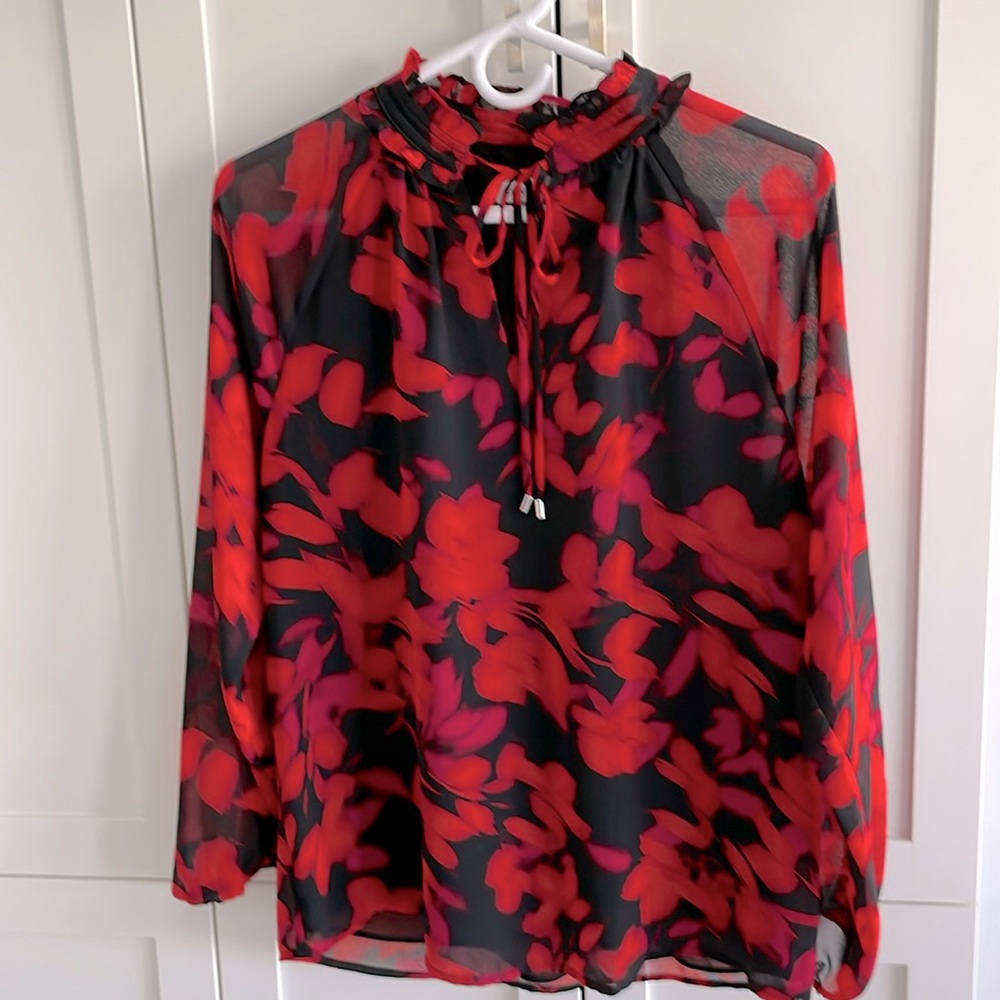 Calvin Klein long sleeve silk top that can tie at the necklace